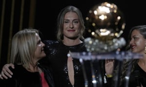 A pleased looking Alexia Putellas, (centre) celebrates with her mother (left) and sister after winning the Women’s Ballon d’Or trophy.