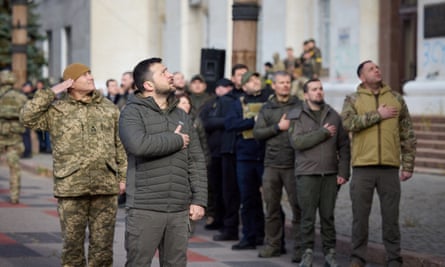 Ukraine’s President Volodymyr Zelenskiy sings the national anthem during his visit in Kherson, Ukraine 14 November 2022.