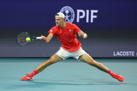 Jakub Mensik stretches for a forehand