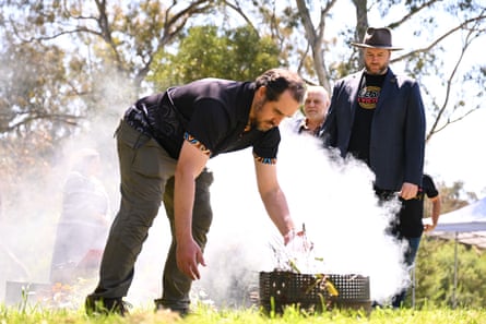 Marcus Stewart (right) takes part in a smoking ceremony on 20 October 2022 ahead of the signing of an agreement that provides the framework and ground rules for treaty-making in Victoria.