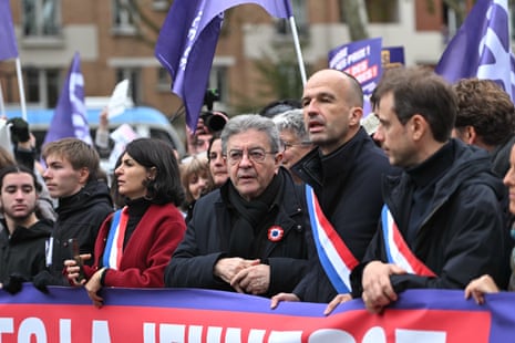 French leftist La France Insoumise (LFI) leader Jean-Luc Melenchon (c) in the Paris protest on 24 October 2026.