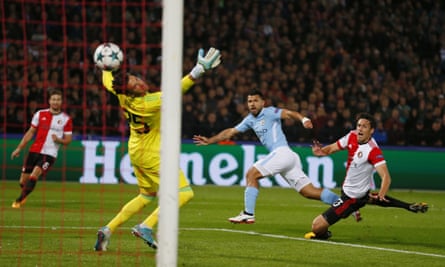 Sergio Agüero fires the ball past Feyenoord goalkeeper Bradley Jones to extend Manchester City’s lead.