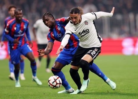 Taylan Bulut of Besiktas is challenged by Jaydee Canvot of Crystal Palace.