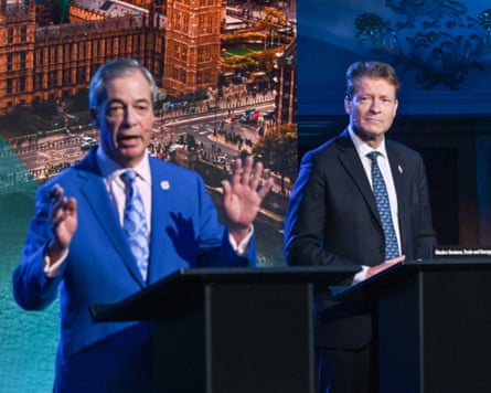 Tice looks on as Farage speaks