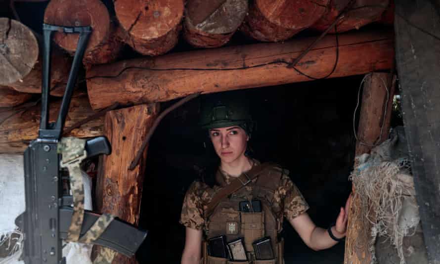 A Ukrainian servicewoman Nataliia looks out of a trench at a position near a frontline, as Russia’s attack on Ukraine continues, in Donetsk Region, Ukraine May 29, 2022.