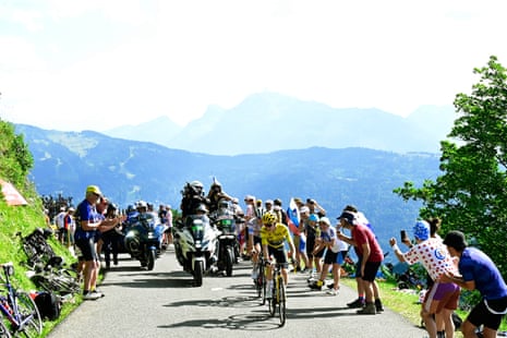 Jonas Vingegaard and Tadej Pogacar cycling up a climb in the area of Les Portes du Soleil during yesterday’s stage 14.