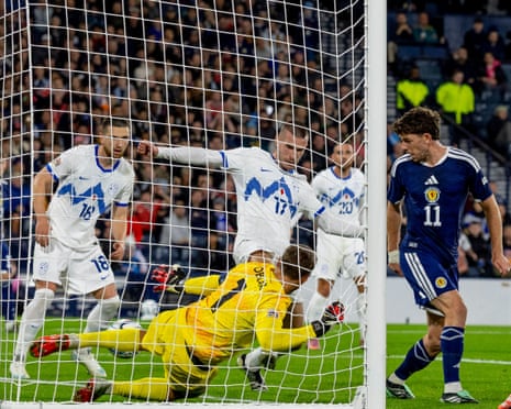 Ryan Christie pops the ball into the net to give Scotland the lead.