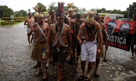 Xukuru's indigenous people sing a sacred prayer in honour of late Brazilian indigenous expert Bruno Pereira during his funeral at the Morada da Paz Cemetery in Paulista, Pernambuco state, Brazil, on June 24, 2022. Pereira, 41, and British journalist Dom Phillips, 57, were shot while returning from an expedition in the Javari Valley, a remote region of the rainforest.