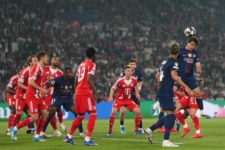 PSG's Joao Neves (right) flicks a header into the Bayern net.