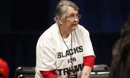 A woman waits for President Donald Trump to arrive for a Black Voices for Trump rally Friday, Nov. 8, 2019, in Atlanta. (AP Photo/John Bazemore)