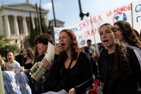 Students chant slogans during a protest over rising housing costs and underfunded education, in solidarity with students in France and Spain, in Athens, Greece,