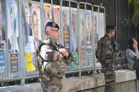 Armed soldiers outside a polling station in Nice.