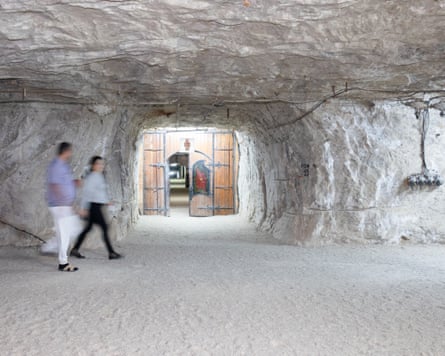 Two patients walking through a salt cave