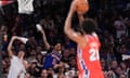 New York Knicks fans try to distract Philadelphia 76ers center Joel Embiid (21) as he attempts a free throw during the second half in Game 1 of an NBA basketball first-round playoff series, Saturday, April 20, 2024, at Madison Square Garden in New York. (AP Photo/Mary Altaffer)