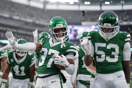 QwanâÂÂtez Stiggers of the New York Jets celebrates with teammates after a touchdown against the Atlanta Falcons