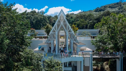 A large building surrounded by forest.