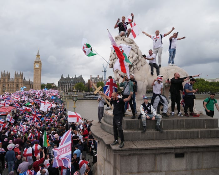 Police assaulted as far-right rally led by Tommy Robinson sparks clashes