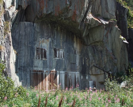 The openings of a secret bunker on the side of a mountain