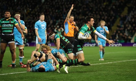 Northampton’s Alex Mitchell crosses the line to score a try against Sale.