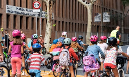 A group of children cycling to school as part of the bicibús.