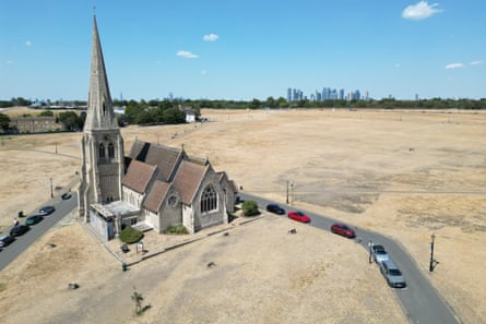 An aerial image showing a church surrounded by scorched grass