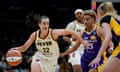 Indiana Fever guard Caitlin Clark (22) controls the ball against Los Angeles Sparks guard Layshia Clarendon (25) during the first half of Friday’s game.