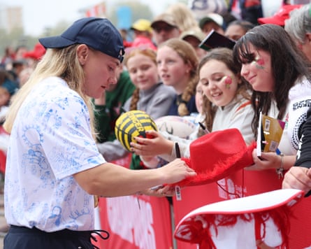 Meg Jones signs autographs for fans during the Red Roses Champions Party.