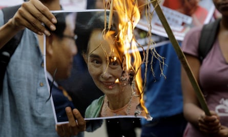 Protesters in Kolkata, India, burn an image of Aung San Suu Kyi