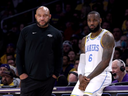 Darvin Ham and LeBron James look on during a 2022 game against the Boston Celtics at Crypto.com Arena.