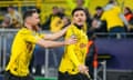 Dortmund's Jadon Sancho (right) celebrates with  Salih Ozcan after scoring his side's opening goal during the Champions League last 16 second leg match against PSV Eindhoven.