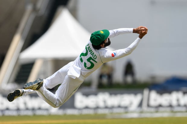 Fawad Alam of Pakistan takes an acrobatic catch to dismiss Jermaine Blackwood of West Indies in August.