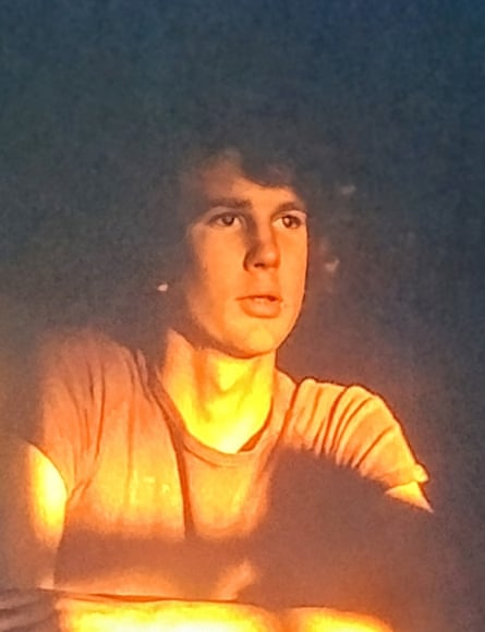 Male teen in yellow light