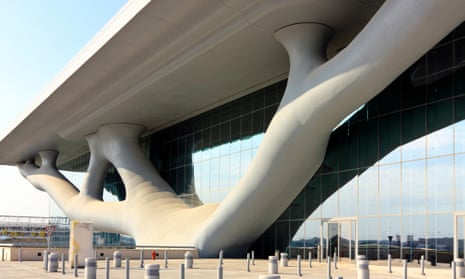 The Qatar National Convention Centre in Doha, with its huge roof supported by a structure of blobby, tubular branches, designed by Arata Isozaki. It opened in 2011.