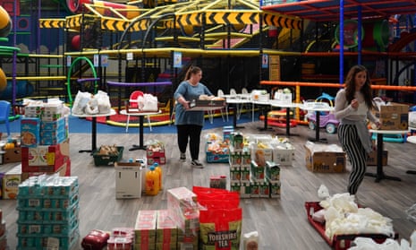 Volunteer staff pack food boxes at the Play Factory in Skelton, York