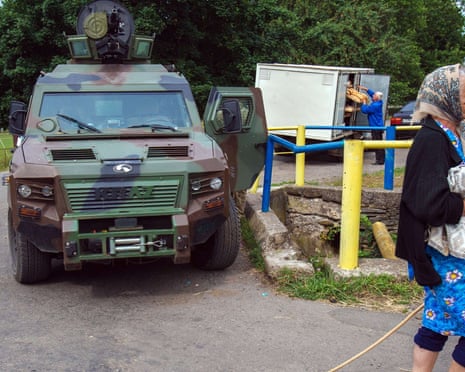 Life goes on in a village near Mukacheve as Ukrainian security forces search for militia fighters of the far-right militia Right Sector. At least two people were killed at the weekend.
