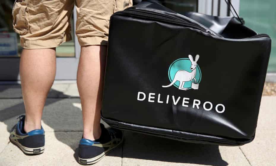 A Deliveroo worker makes a delivery
