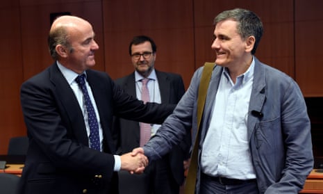  Greek Finance Minister Euclid Tsakalotos (right) has persuaded his eurozone colleagues to finally unlock bailout loans for Athens