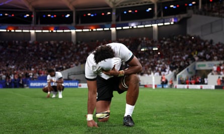 Fiji players show their disappointment at full time of their 23-24 defeat to Portugal
