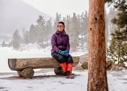 Muenchrath sitting on a log bench in the snow
