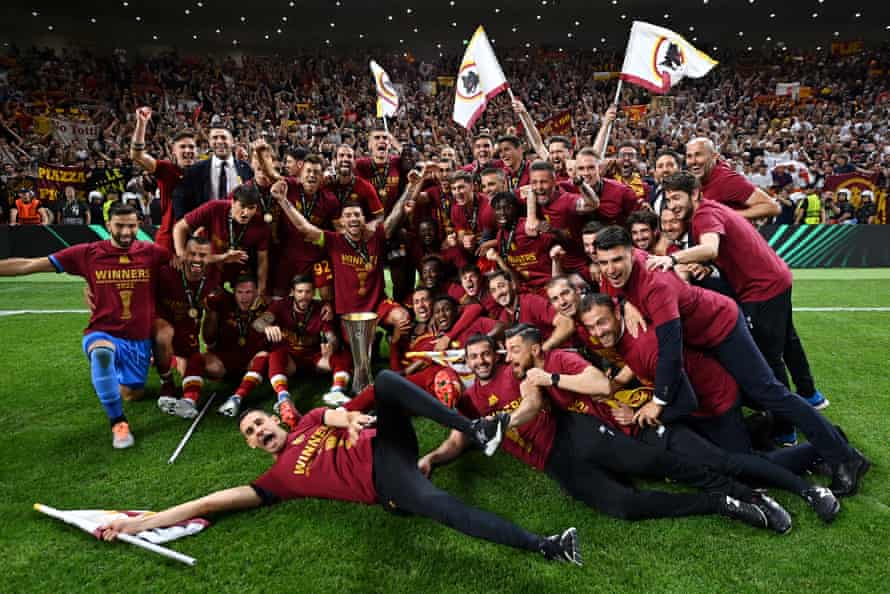 Players and staff of Roma celebrate with the UEFA Europa Conference League trophy after their sides victory over Feyenoord.