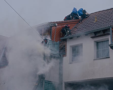 Activists climb on the roof of Paulshof