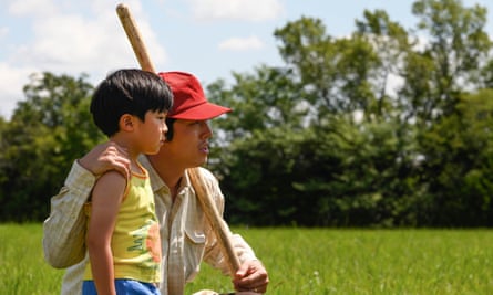 Alan S Kim and Steven Yeun in Minari. Lee Isaac Chung’s nuanced portrait of a family figuring out their place in the world is both small and somehow rather grand.