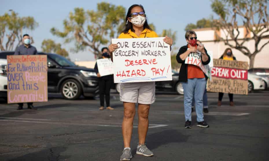 Food4Less workers protest outside their grocery store to call on their parent company, Kroger, to keep the stores open, in Long Beach, California, on 3 February. 