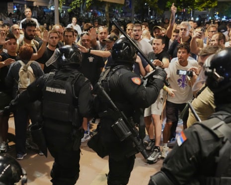 Serbian gendarmerie officers separate protesters from opposing camps during an anti-government protest in Belgrade, Serbia.