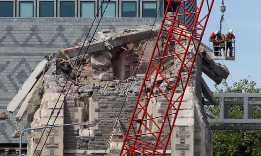 Recovery workers inspect the fallen spire of Christchurch Cathedral on 2 March 2011.