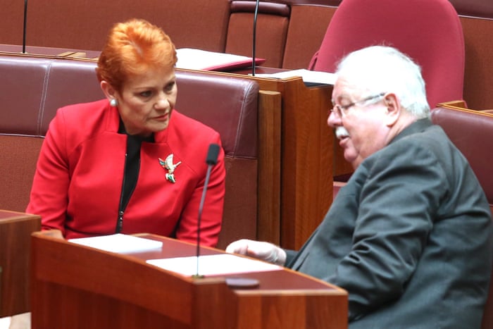 Pauline Hanson talks to Barry O’Sullivan during debate in the senate chamber of parliament house Canberra this morning.