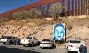 A portrait of 16-year-old Mexican youth Jose Antonio Elena Rodriguez is displayed on the street where he was killed that runs parallel with the US border. 