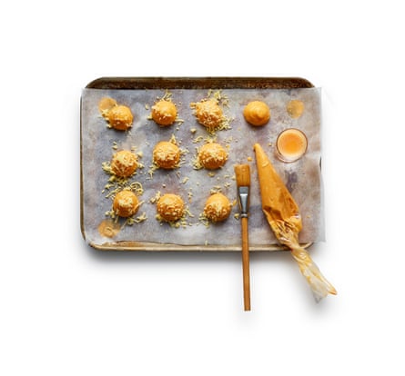 Spoon or pipe balls of the pastry mix on to lined oven trays, brush with egg and bake for 20 minutes.