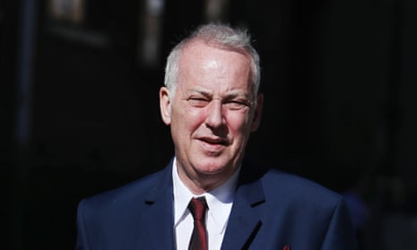 Michael Barrymore leaves the high court in London, where a judge is to decide the amount of compensation to be paid to the entertainer by Essex police.