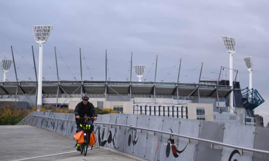 People are seen outside of the MCG in Melbourne on Wednesday.